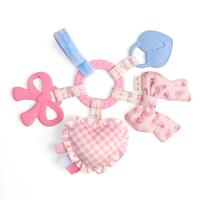 Itzy Ritzy Teething Activity Toy - Bitzy Busy Ring Infant Teething Toy Features Braided Teether & Dangling Toys, Includes Textured Ribbons, Crinkle Sound & Jingle Bell - 0 Months & Up (Pink Bow)