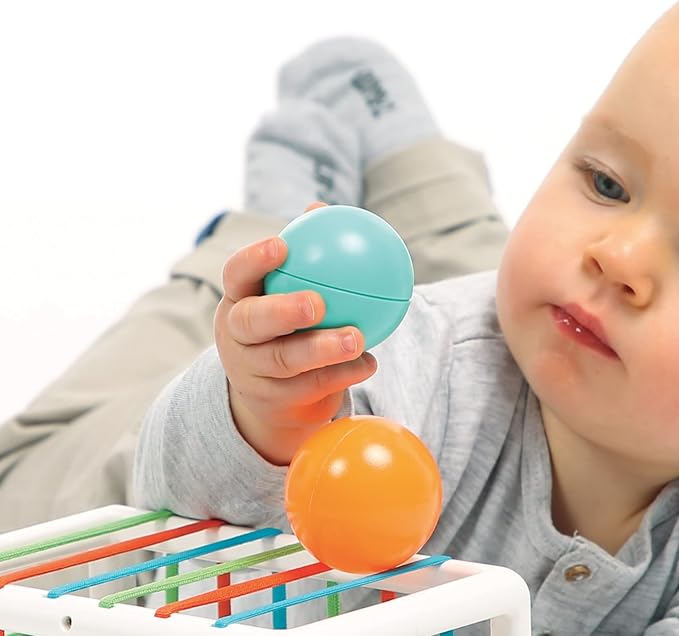 Ludi - Handling Cube - Early Learning Toys for Babies from 10 Months - Develops Thought, Fine Motor Skills, Touch & Discovery - 1 Elastic Cube + 12 Orange & Blue Balls with Funny Sound