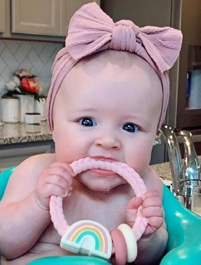 Itzy Ritzy Silicone Teether with Rattle – Rattle Teether Features Rattling Sound, Two Silicone Teething Rings and Raised Texture to Soothe Gums – Ages 3 Months and Up (Pink Rainbow)
