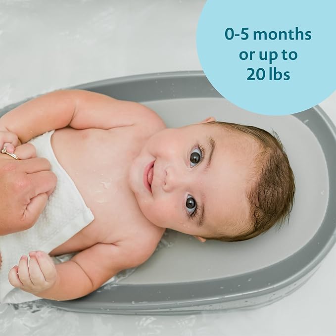 The First Years Sure Comfort Renewed Baby Bather - 50% Recycled Material Baby Bath Seat - Baby Bath Support for Infants - Newborn Bath Essentials Ages 0 to 5 Months