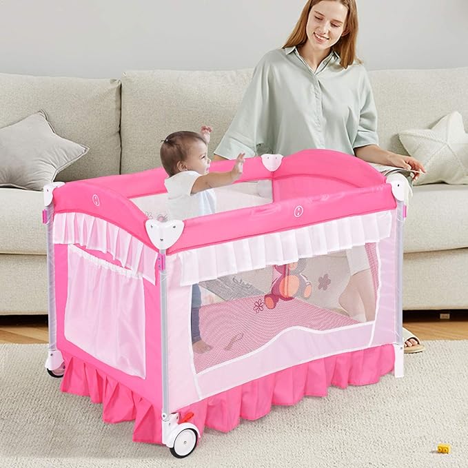 INFANS 4 in 1 Pack and Play, Portable Nursery Center Playard with Bassinet, Adjustable Canopy, Mattress, Diaper Changer, Carry Bag, Whirling Toys Music Box for Baby Boy Girl (Pink)
