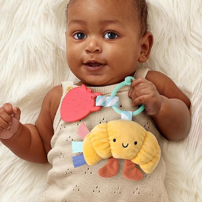 Itzy Ritzy Infant Toy & Teether - Itzy Pal Baby Teething Toy Includes Lovey, Crinkle Sound, Textured Ribbons & Silicone Teether for Newborn (Croissant)