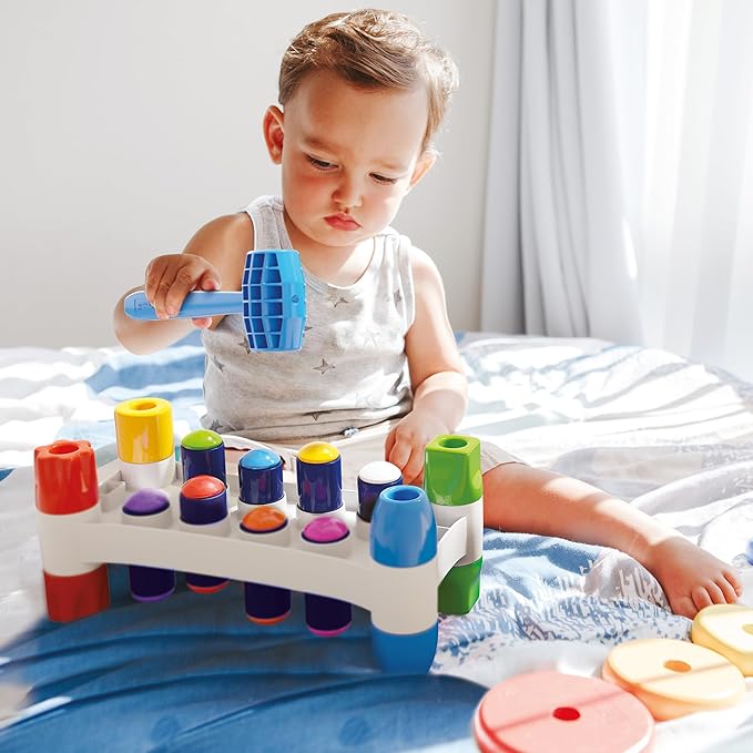 Quercetti: Hammer Peggy - Classic Peg Pounding Bench Toy, Interactive & Colorful, Raise & Lower The Sturdy Board, Cause-Effect Play, Toddler-Kid 18mo+