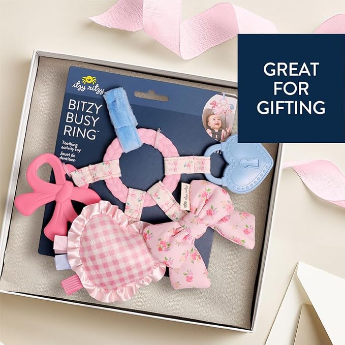 Itzy Ritzy Teething Activity Toy - Bitzy Busy Ring Infant Teething Toy Features Braided Teether & Dangling Toys, Includes Textured Ribbons, Crinkle Sound & Jingle Bell - 0 Months & Up (Pink Bow)