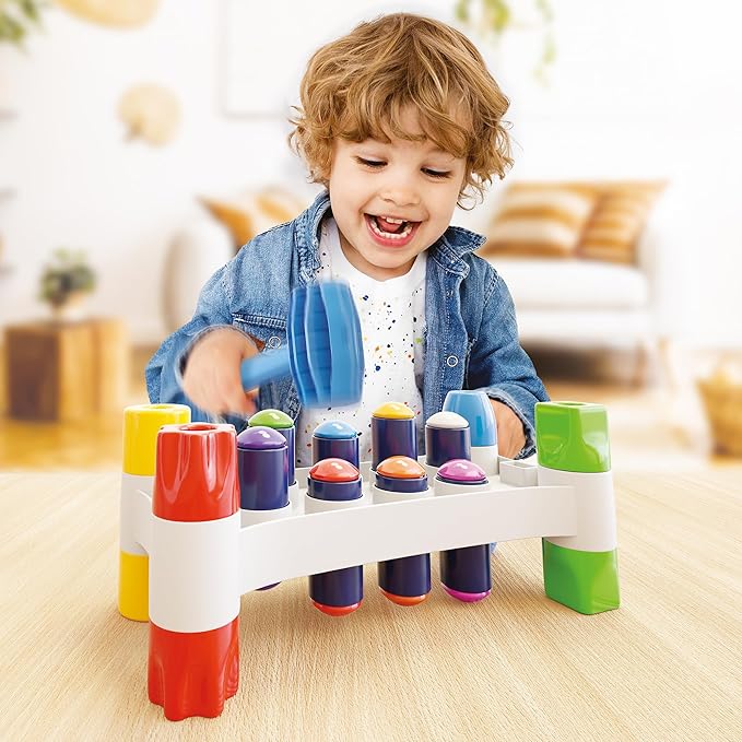 Quercetti: Hammer Peggy - Classic Peg Pounding Bench Toy, Interactive & Colorful, Raise & Lower The Sturdy Board, Cause-Effect Play, Toddler-Kid 18mo+