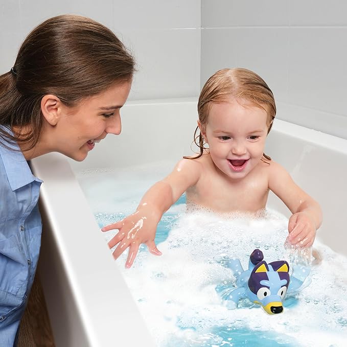 Bluey Swimming Bath Toy by TOMY Toomies - Bluey Toys Includes Retractable Seahorse and Swims on Back or Front - Bath, Beach or Pool Toys - Ages 18 Months and Up