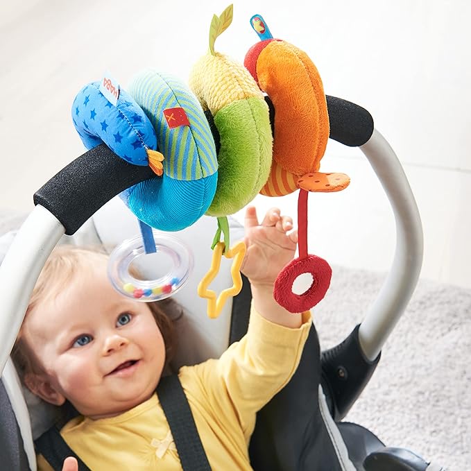 HABA Rainbow Activity Spiral Car Seat Toy and Stroller Toys for Baby 0-18 Months - Colorful Baby Travel Toy with Rattle Teething Element and Sensory Activities