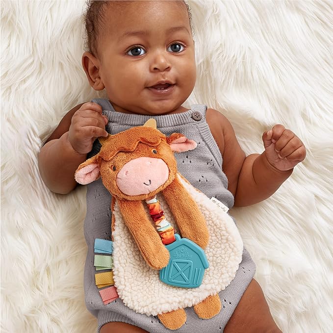 Itzy Ritzy - Itzy Lovey Including Teether - Baby Lovey with Teether, Textured Ribbons & Dangle Arms - Features Crinkle Sound, Sherpa Fabric and Minky Plush (Highland Cow)