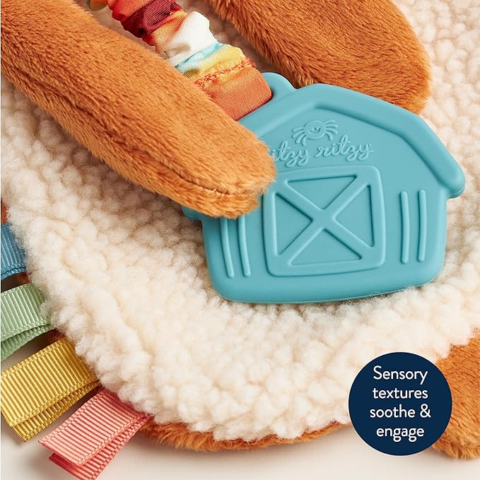 Itzy Ritzy - Itzy Lovey Including Teether - Baby Lovey with Teether, Textured Ribbons & Dangle Arms - Features Crinkle Sound, Sherpa Fabric and Minky Plush (Highland Cow)